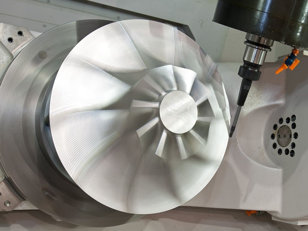 5 Axis High-precision 5-axis machining center cutting complex geometries, enabling multi-sided part access and advanced surface finish in one setup.