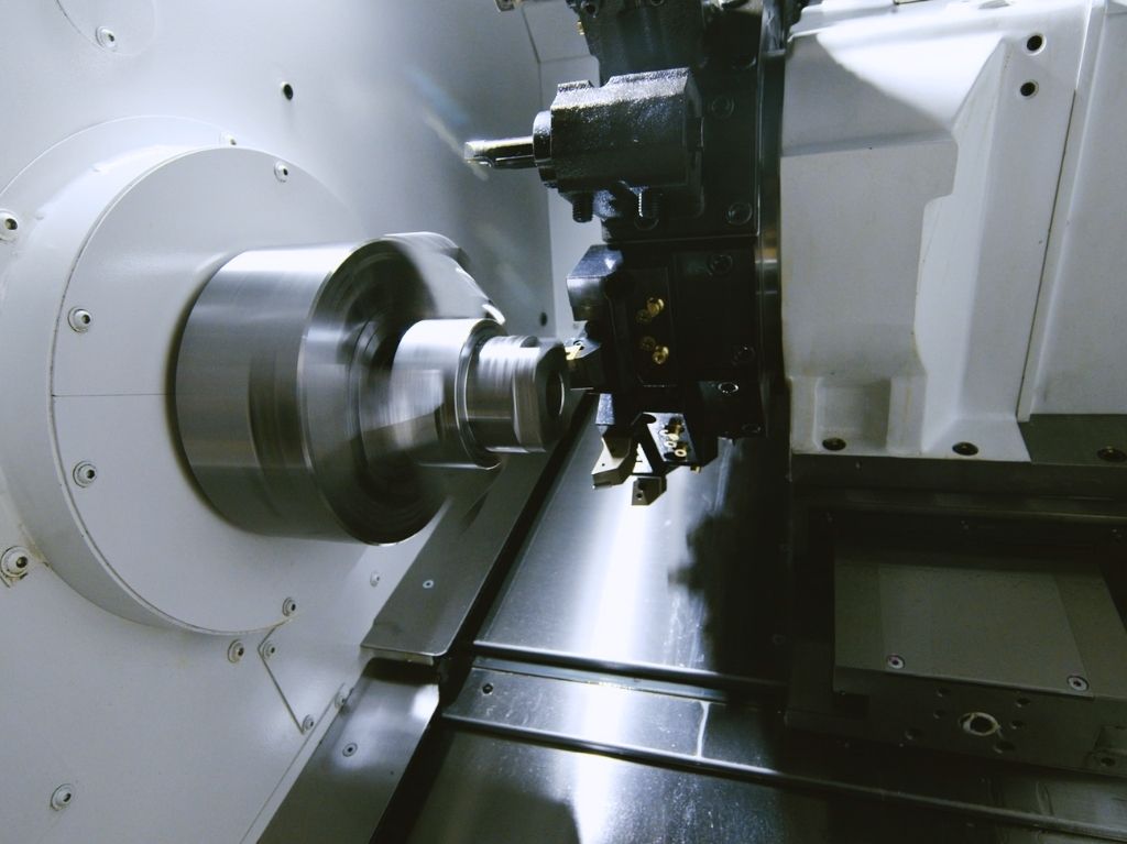 Horizontal Lathes Horizontal lathe machining a long shaft, highlighting stable support and consistent turning for cylindrical workpieces in high-precision environments.