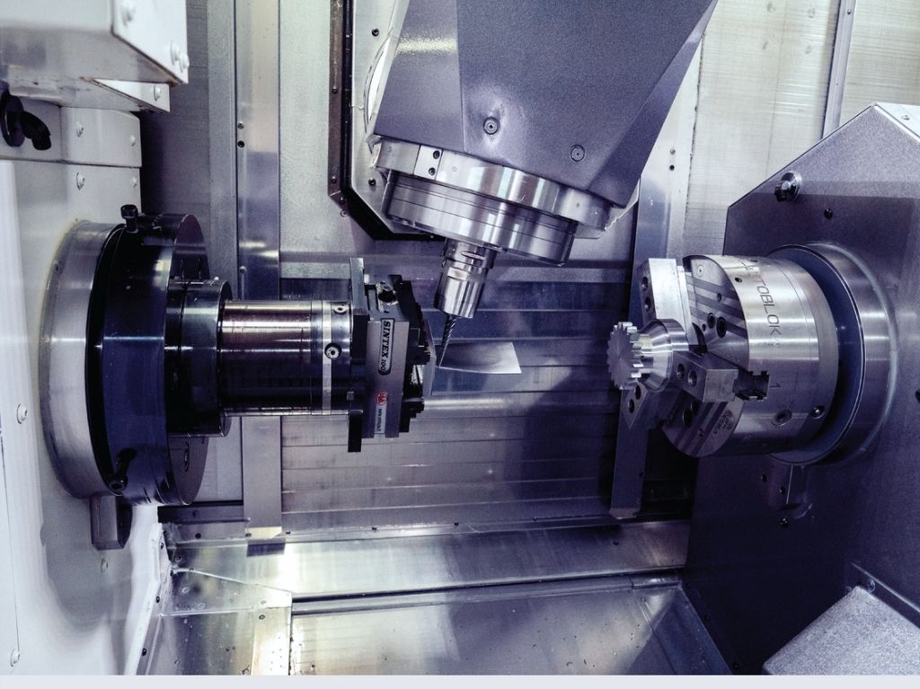 Multi Tasking Multitasking CNC machine simultaneously milling and turning a complex part, reducing setup time and improving throughput in high-mix production.