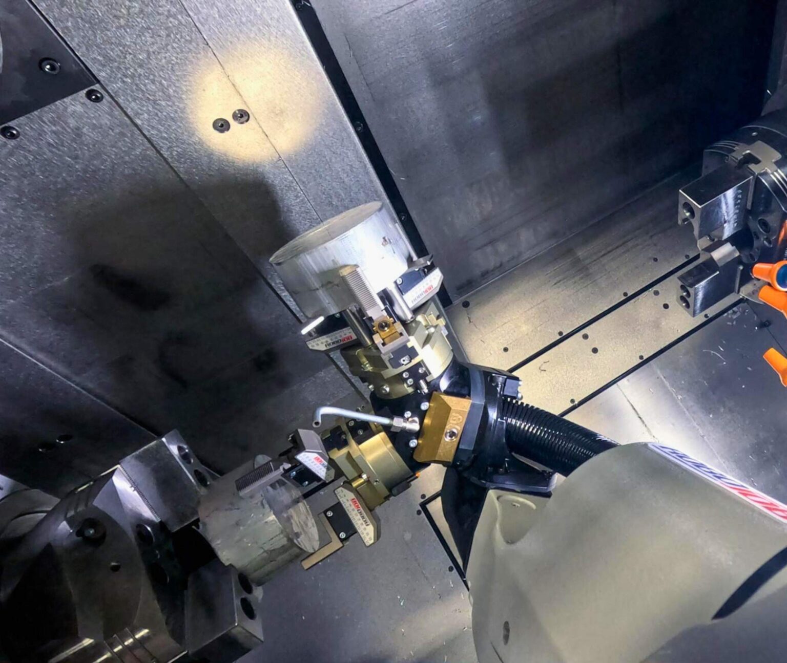 RoboJob Turn Assist Mini industrial robot installed on Tsugami TMA8F, multifunction turn/mill machine for lathe automation