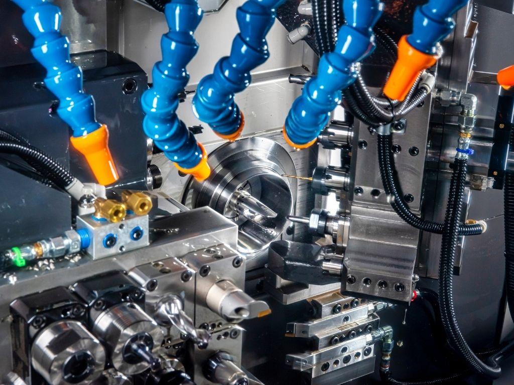 Swiss Swiss-style CNC lathe producing small, high-precision parts with long bar stock, perfect for medical, electronics, and aerospace manufacturing.