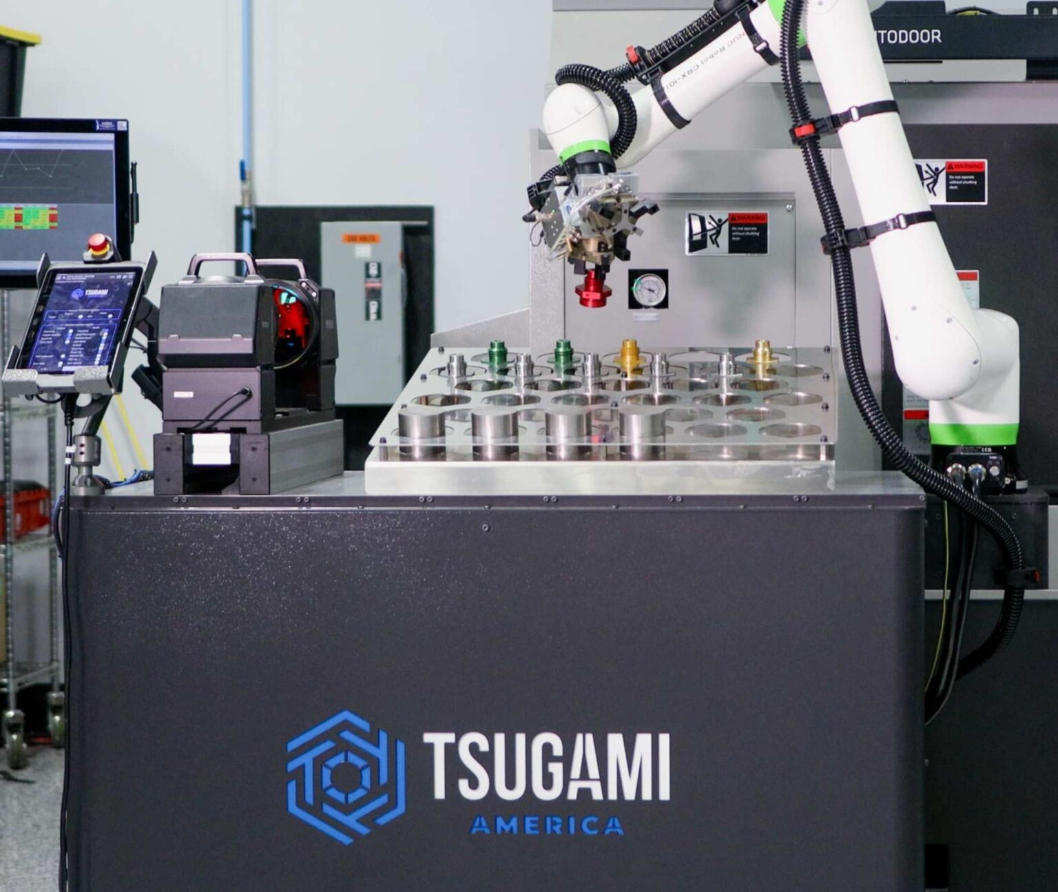 Tsugami America cobot picking up part for M08SY-II for standard small part manufacturing automation