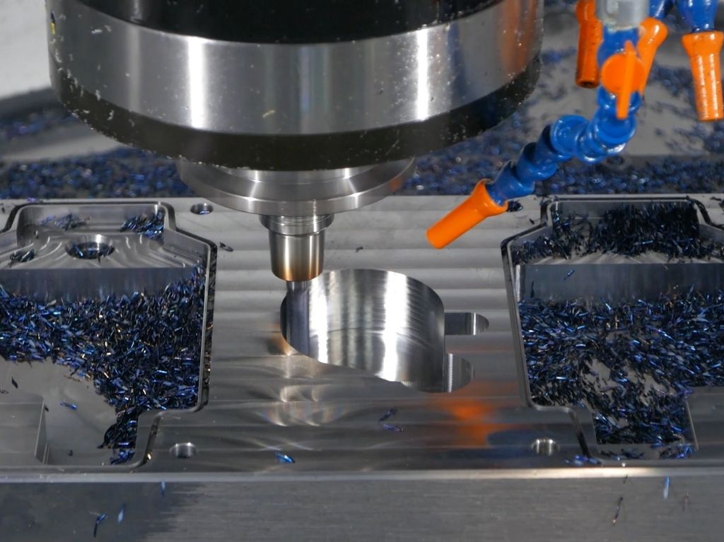 Vertical Machining Centers Vertical machining center drilling a precision part, delivering high-speed, multi-operation performance with reduced setups and tighter tolerances.