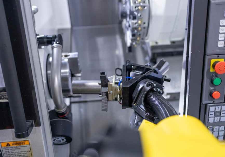 Featured image for 2024 CNC Industry Trends article that shows automation with machining