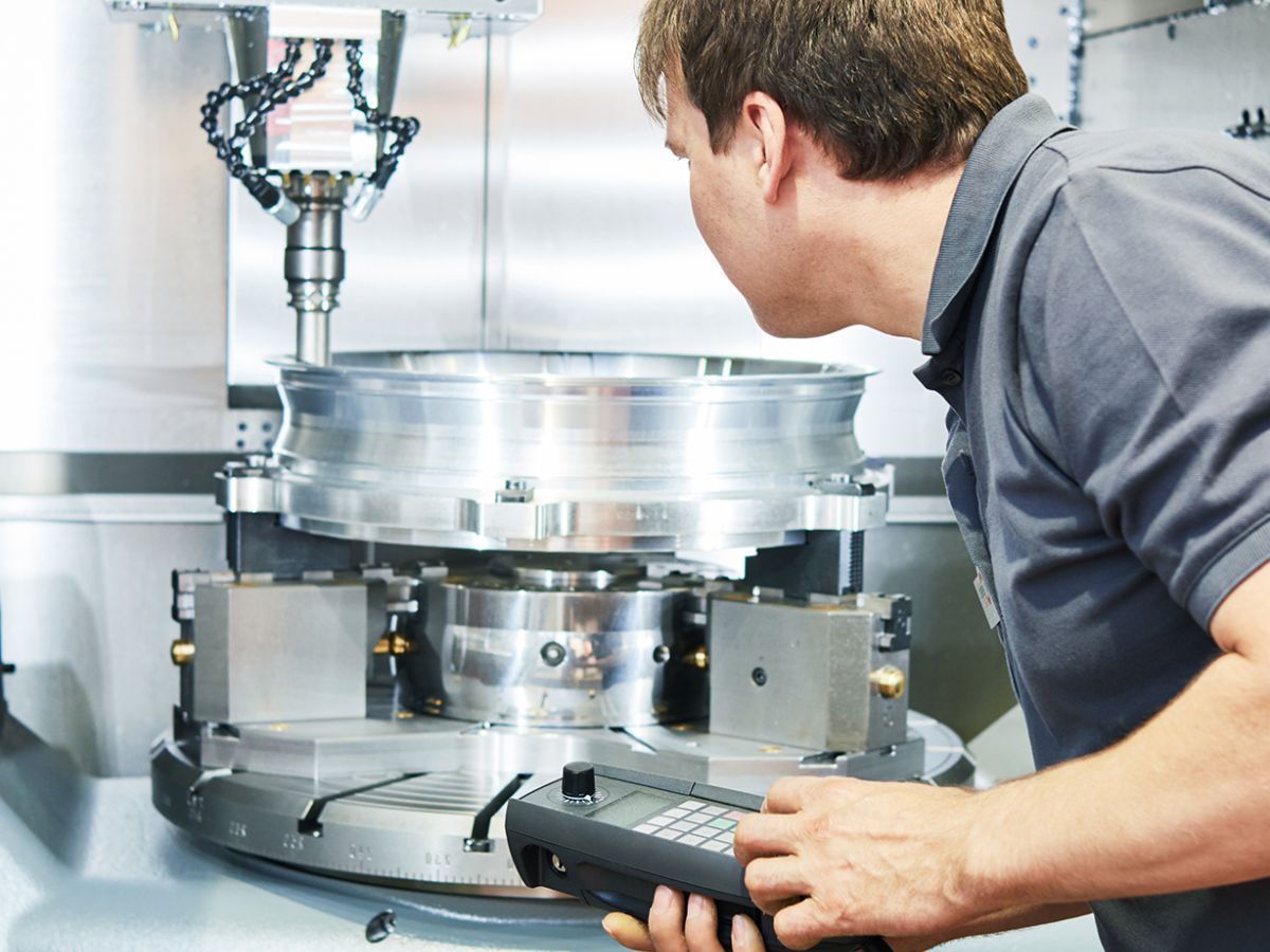 Morris Plus, Morris Productivity Specialists inspecting a cnc machine