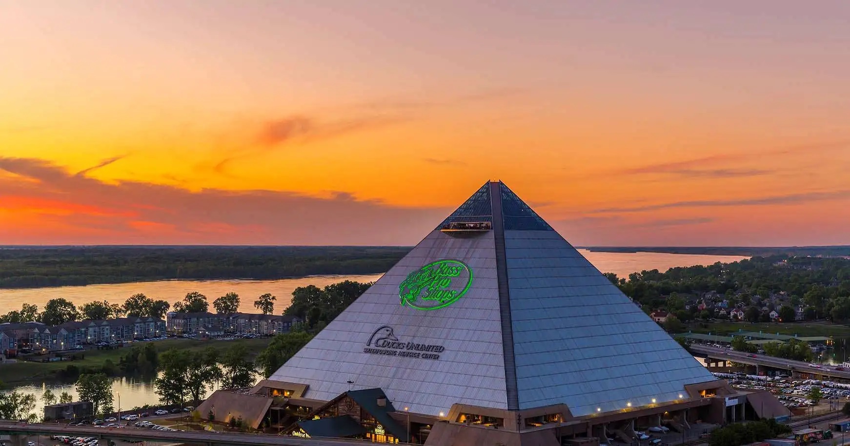 Pyramid Exterior With Sunset Sign Lit